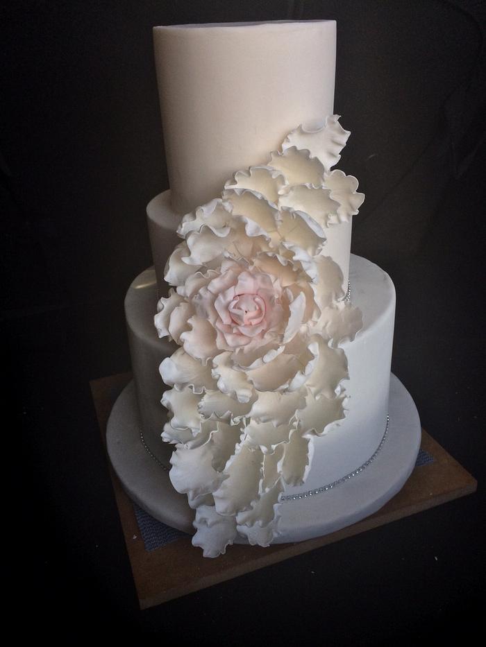 Cascading flower wedding cake.