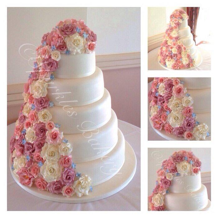 5 tier wedding cake with cascading flowers