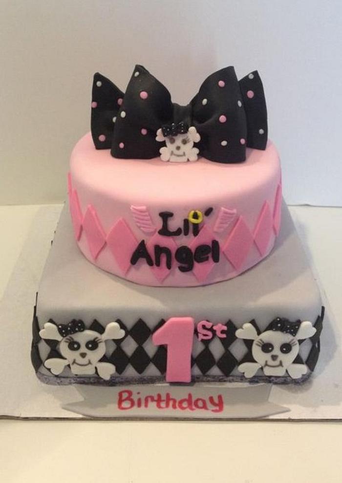 1st birthday pink and black skull cake