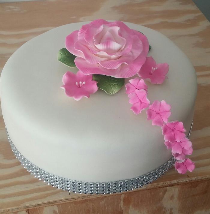 Sweet cake with pink flowers