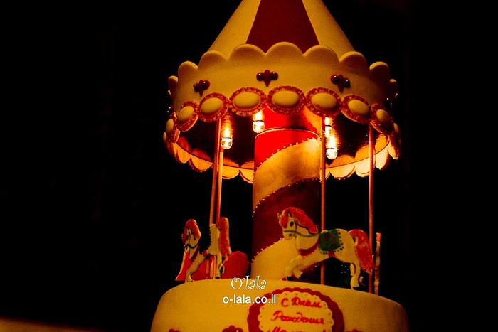 spinning carousel cake with lights