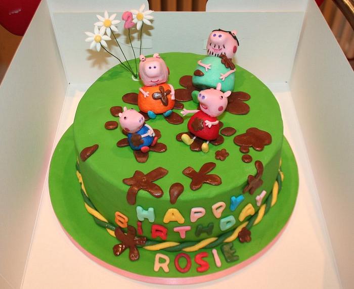 Peppa Pig and family splashing in muddle puddles