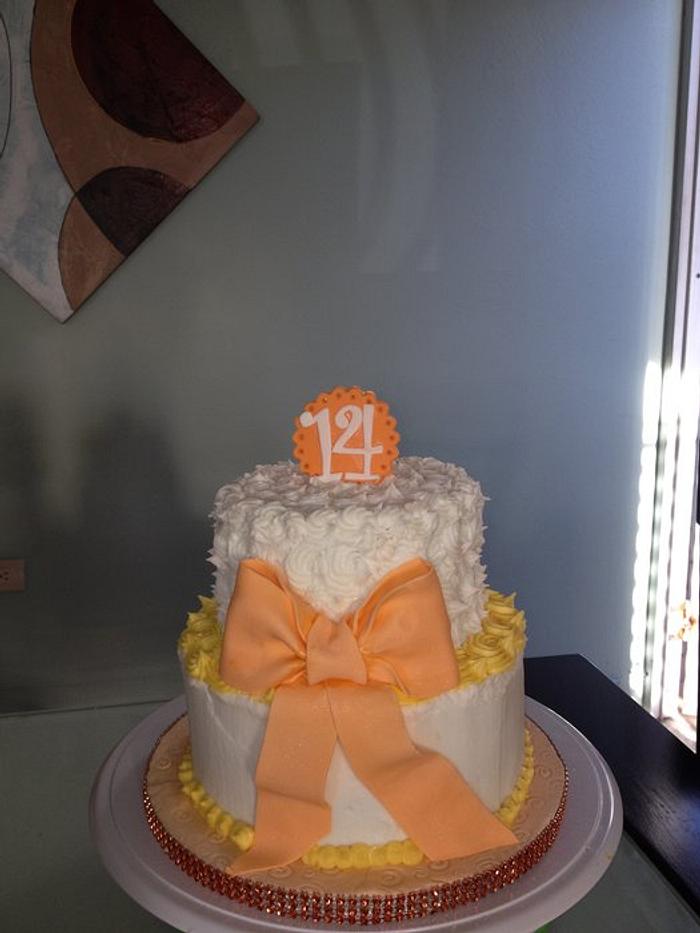 White and orange 14 th cake