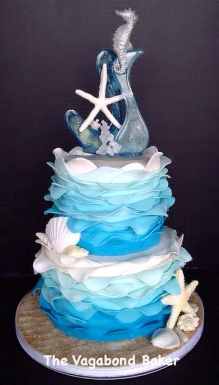 Blue and White Ombre seashell cake with sugar sculpture topper