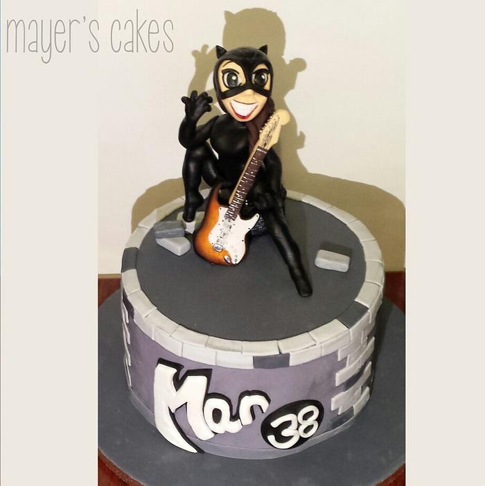 Catwoman rocks a Stratocaster