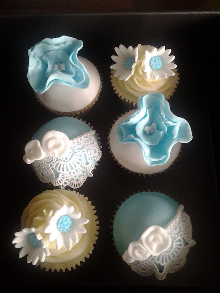 Pretty blue and white cupcakes.