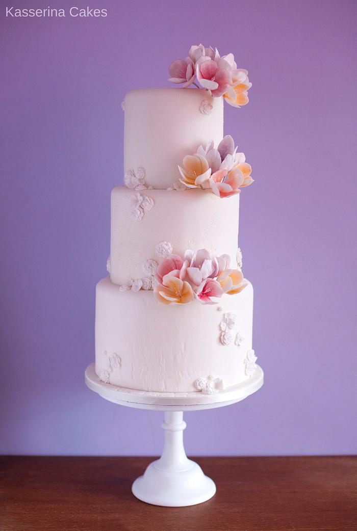 White textured cake with fantasy flowers