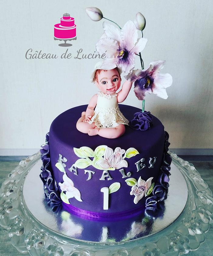 Cattleya orchid cake with the figure of a little girl