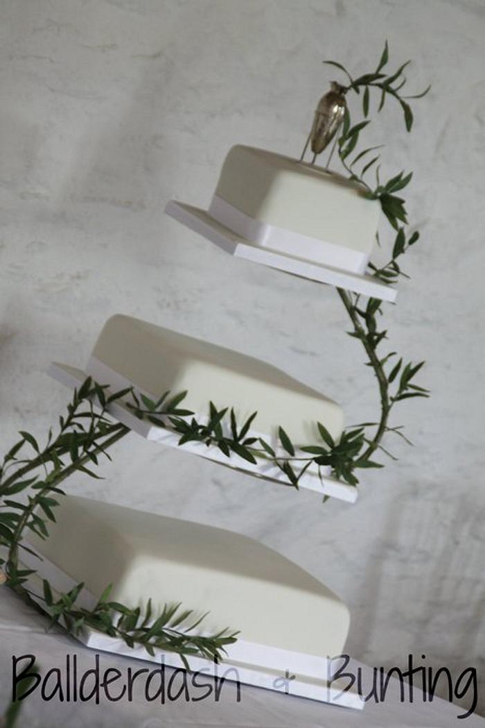 Simple olive leaf wedding cake