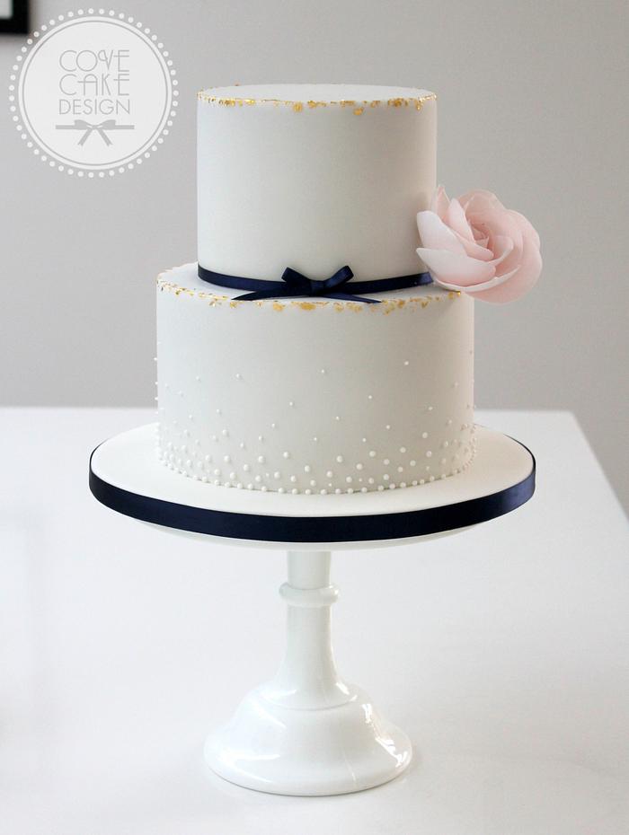 Gilding and pearls wedding cake