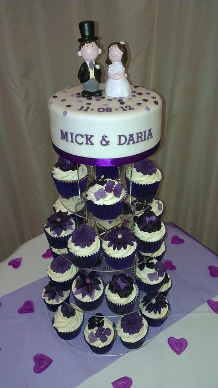 Purple flower wedding cupcakes and cake