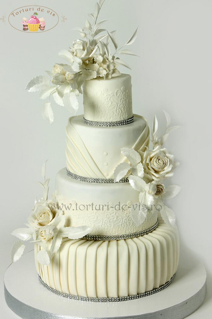 White wedding cake with white roses