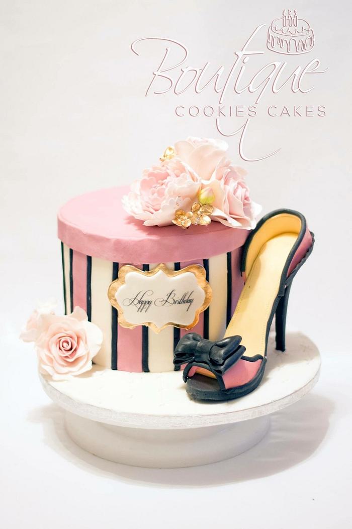 Pink flowers box with high-heeled shoes