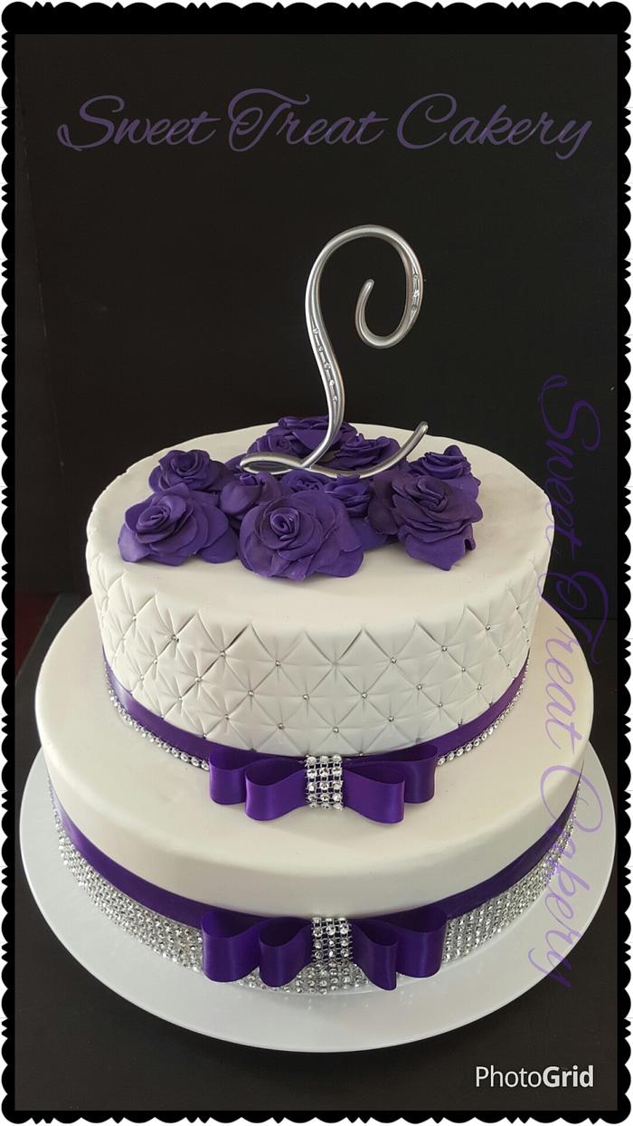 Sugar paste Purple roses and fondant tiered wedding cake