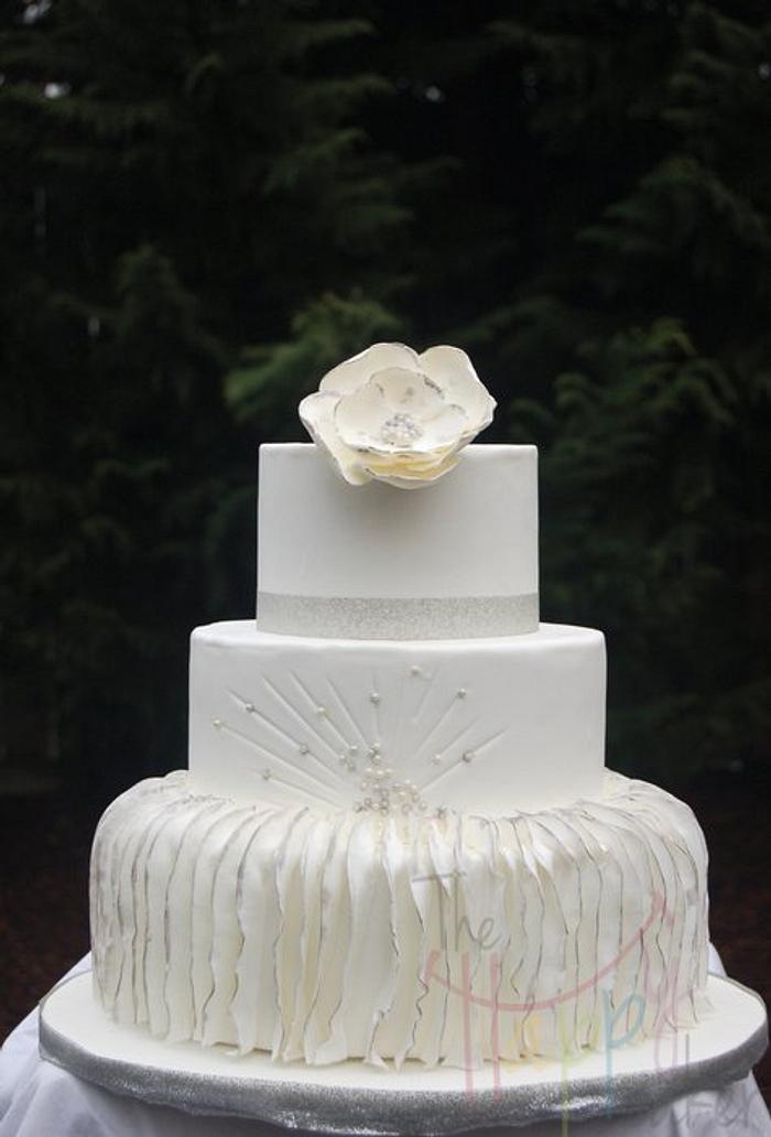 White and silver vertical ruffle cake