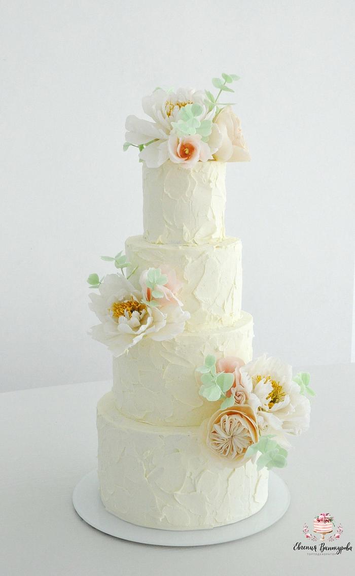 Cream wedding cake with sugar flowers