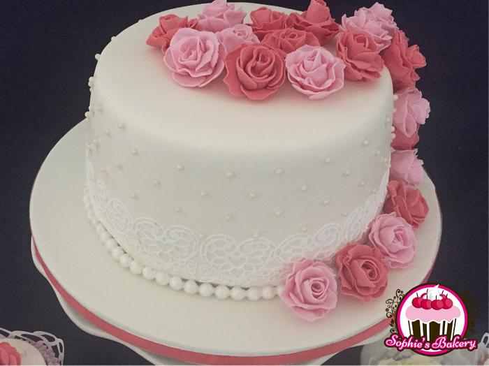 Little wedding cake with matching red velvet cupcakes