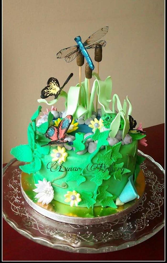 Nature cake with butterflies and a dragonfly