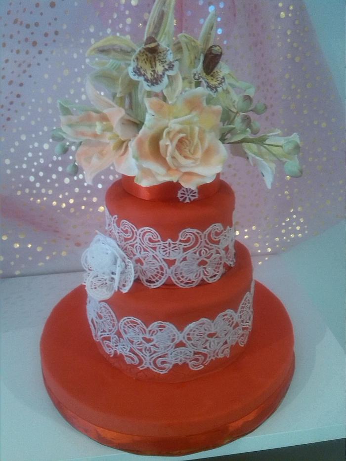 red cake and flowers