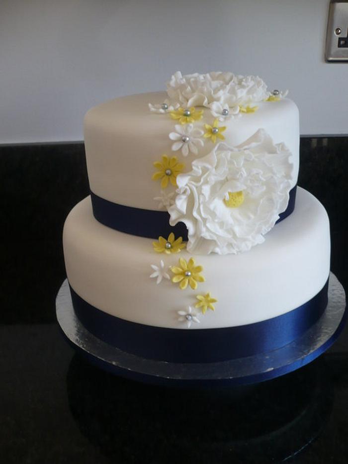 Wedding Cake flowers & blue ribbon
