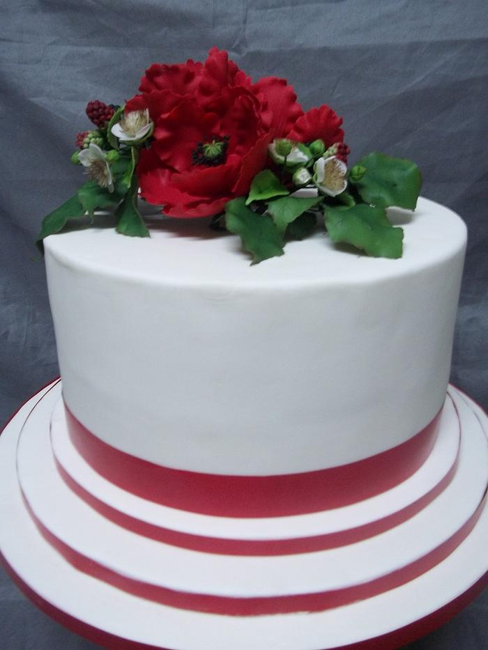 Poppy and blackberry wedding cake