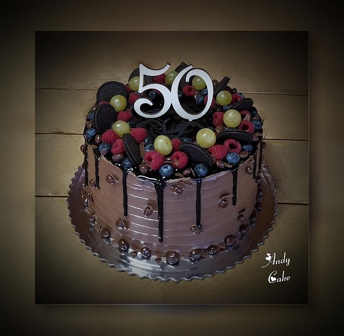 Chocolate birthday cake with fruits