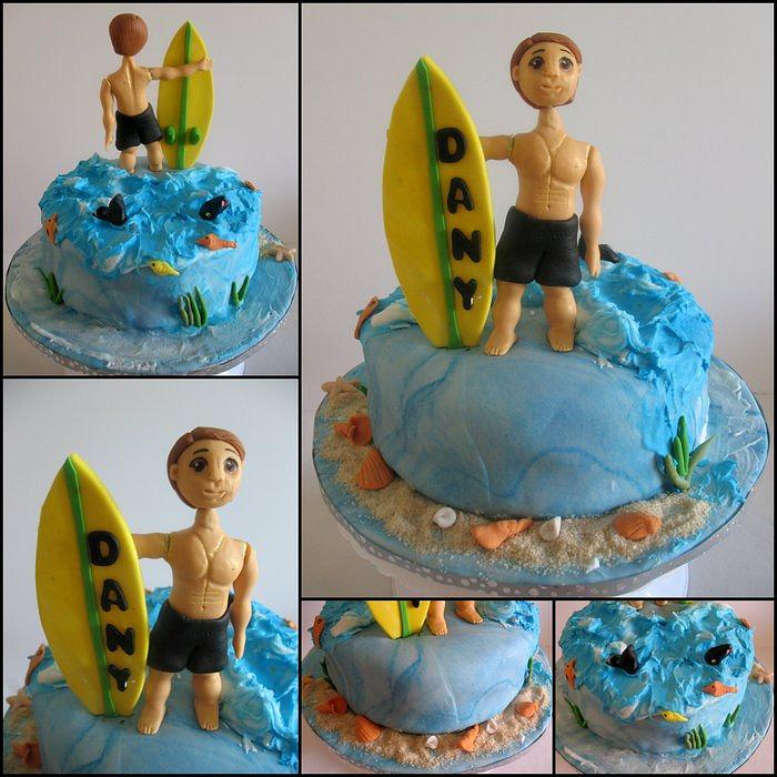 A Surfer and Surfboard Cake 