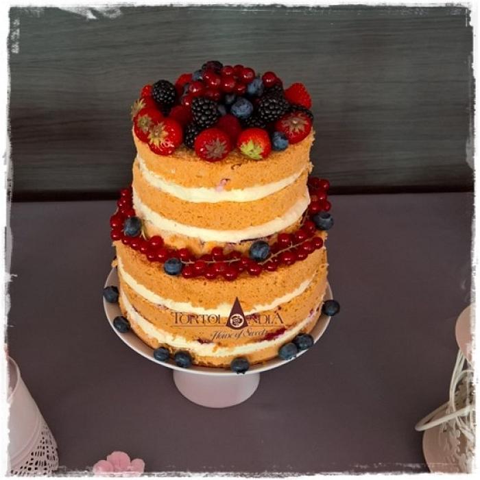Naked wedding cake with fresh fruits