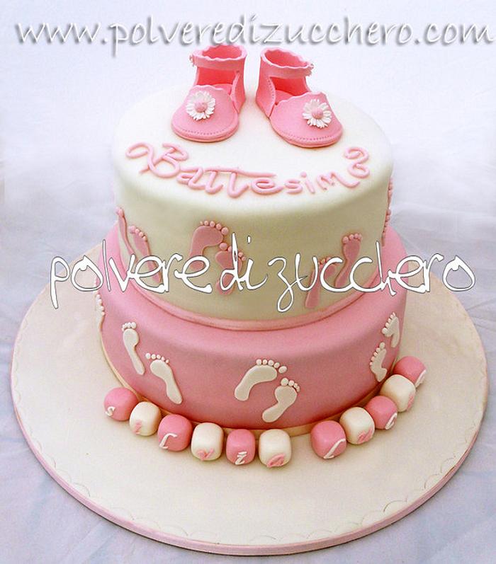 Christening cake with baby girl shoes
