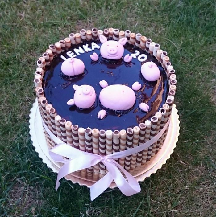 Chocolate birthday cake with pigs