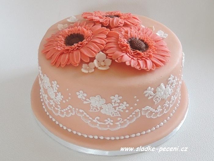 Birthday cake with lace and gerbera flowers