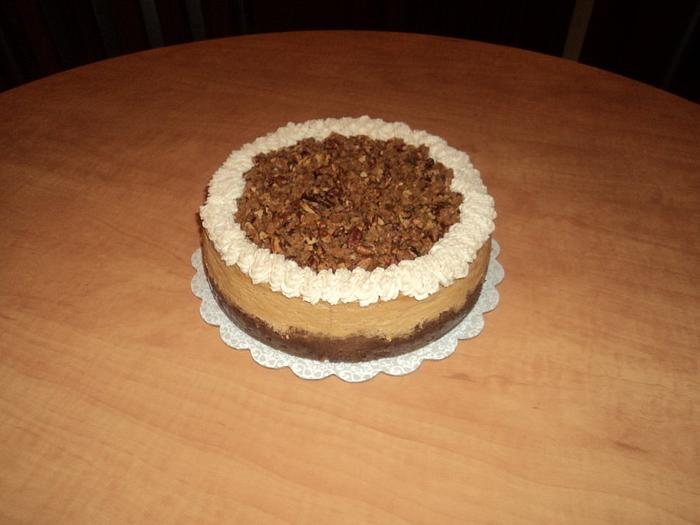 Pumpkin cheesecake w/pecan praline topping & cinnamon whipped cream