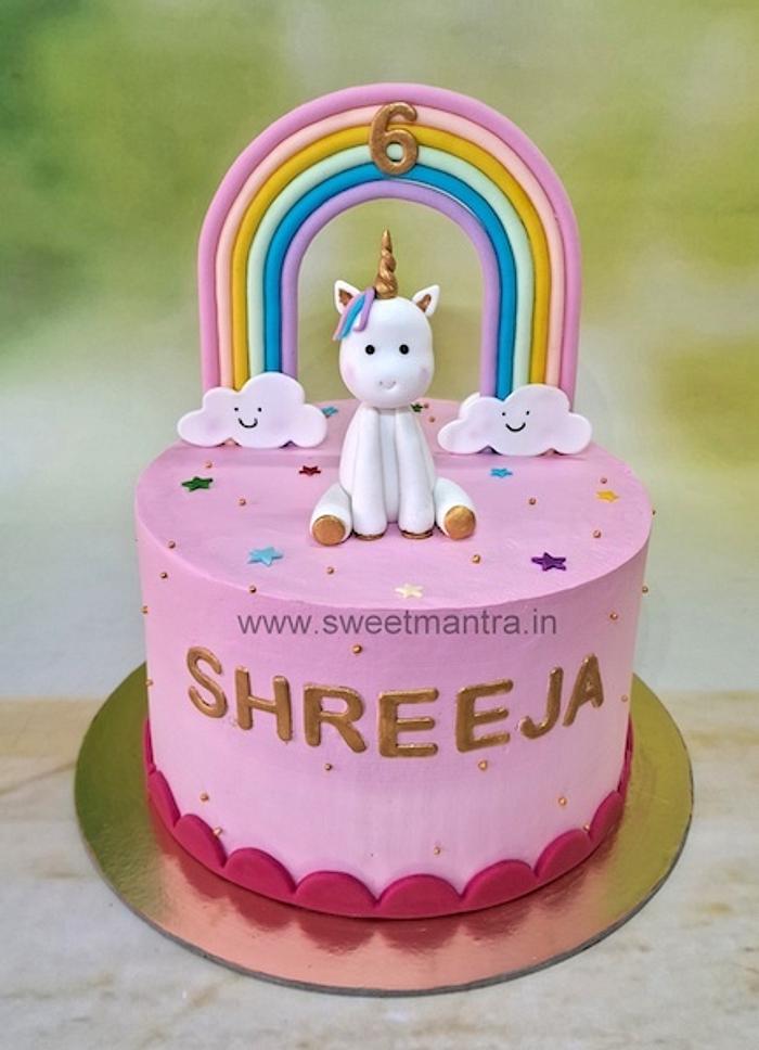 Unicorn cream cake with rainbow