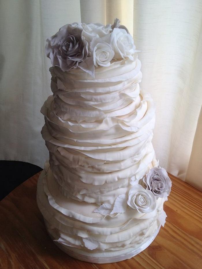 Ivory Ruffles with White and Gray Roses Wedding Cake