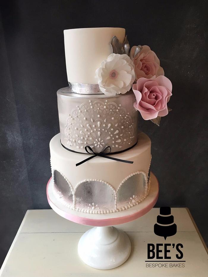 Modern pink and silver wedding cake