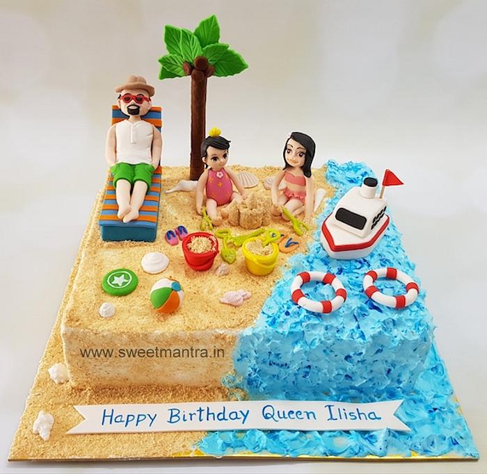 Family on beach theme cake