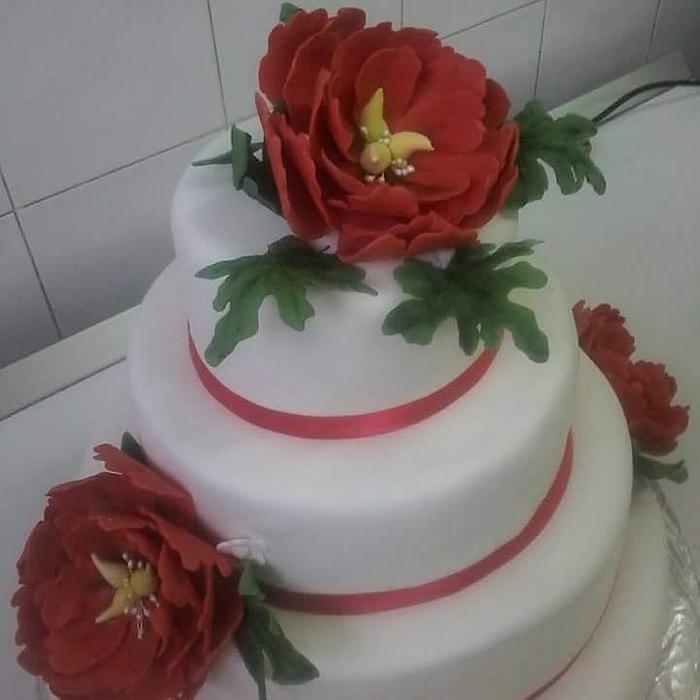 White cake with red flowers
