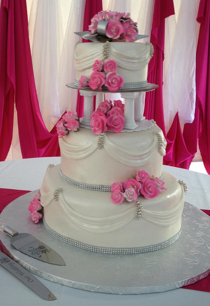 White Wedding Cake with Pink Floral Accents
