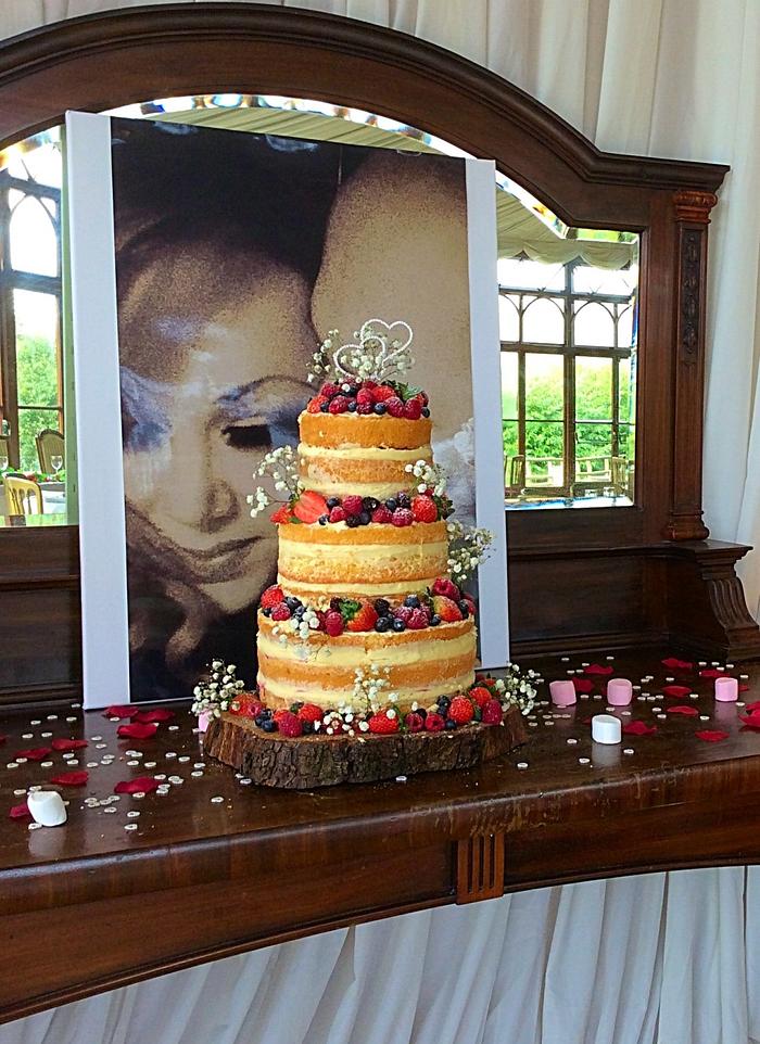 Naked wedding cake with fresh forest fruit 