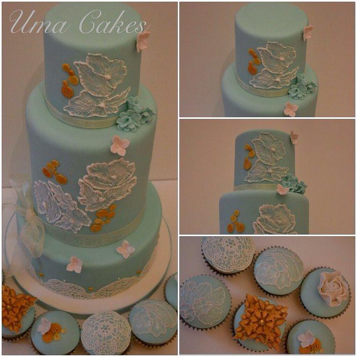 Ice blue & antique gold wedding cake