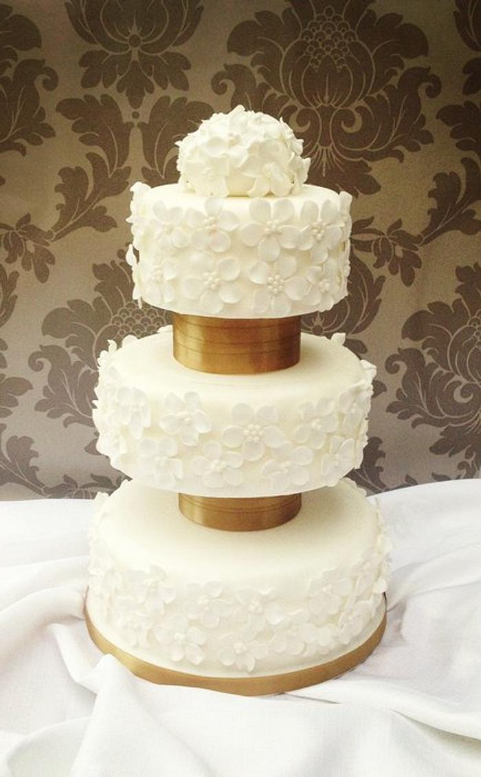 White wedding cake with sugar blossoms