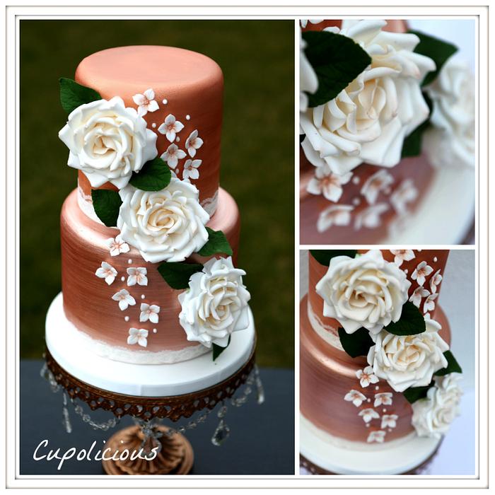 Gold and white wedding cake