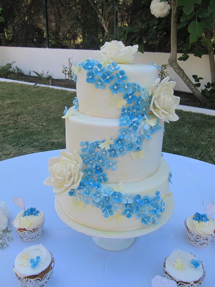 Wedding cake with iced Hydrangeas and roses