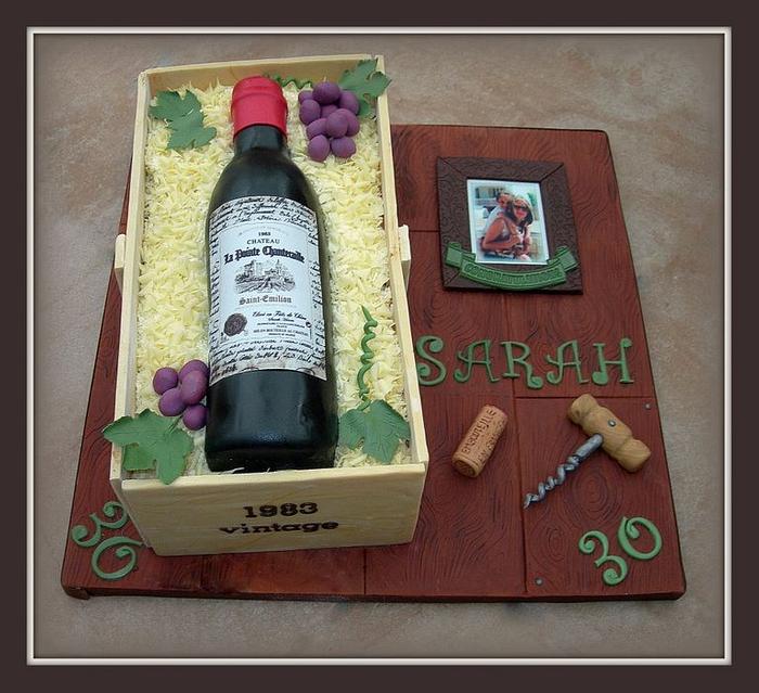 Red wine bottle in a crate cake