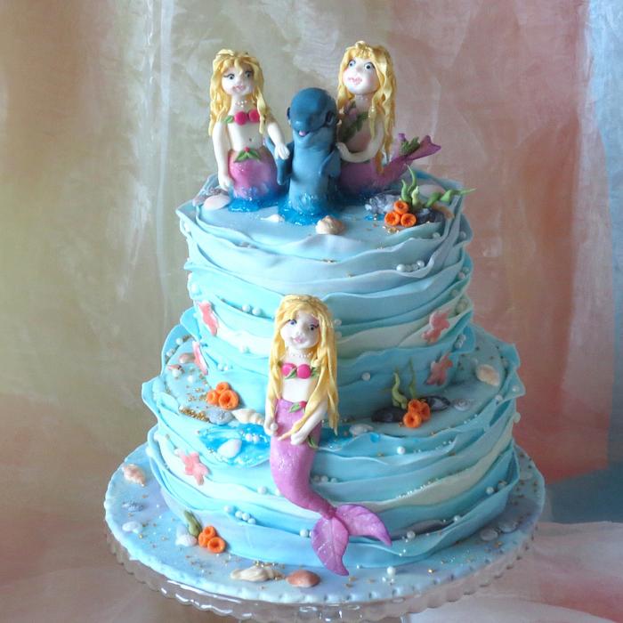 Mermaids with dolphin
