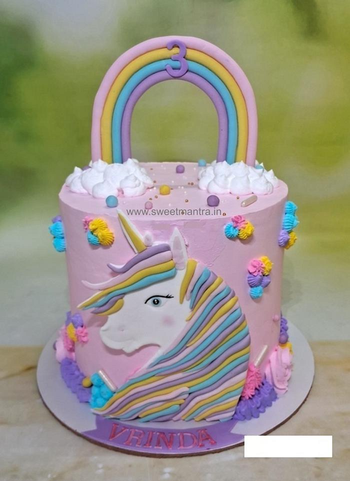 Pink unicorn cream cake