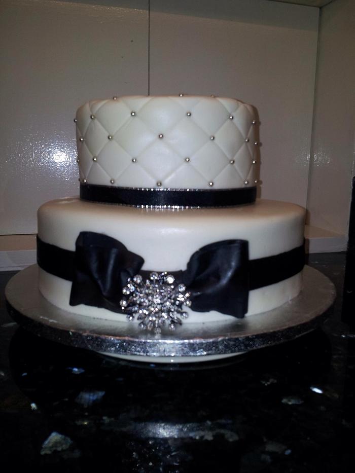 Black and white diamanté bow cake