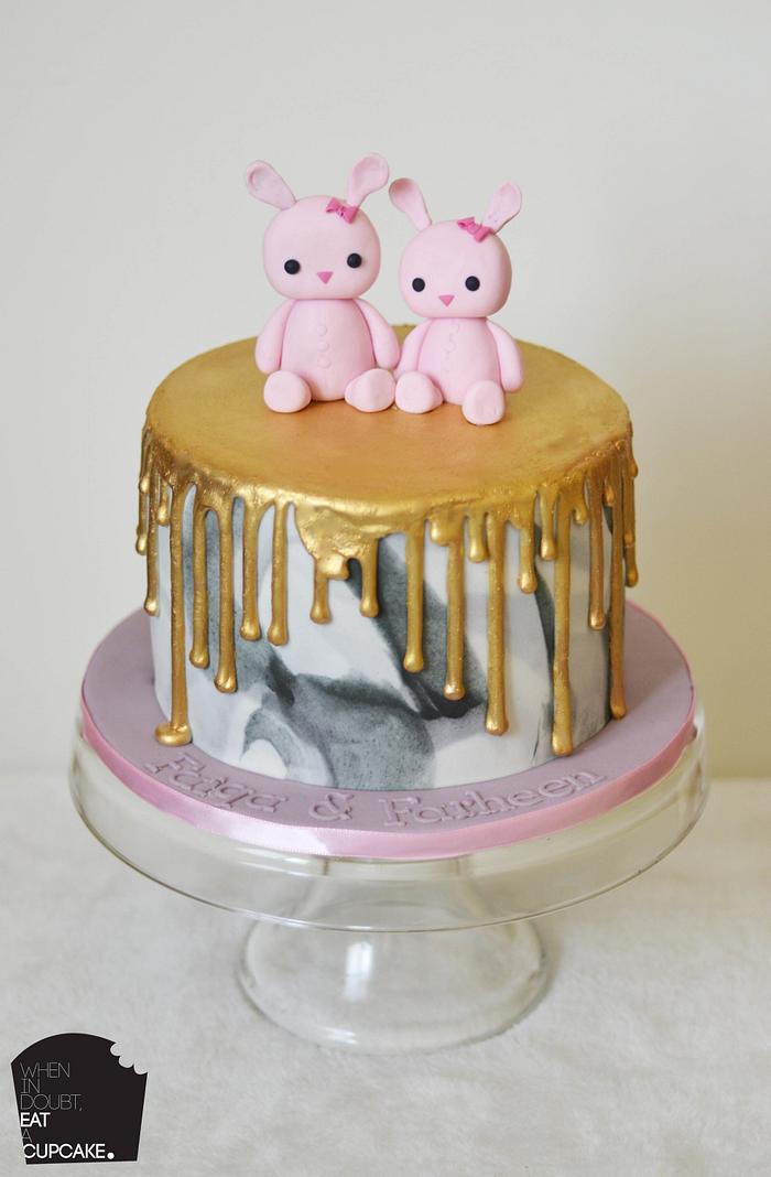 Bunnies on a gold drip marbled cake