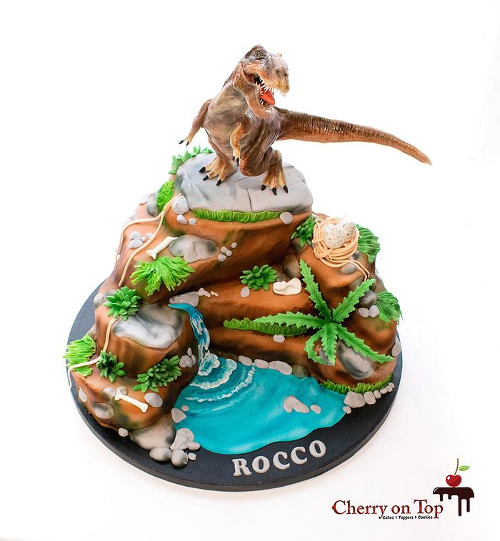 T-Rex on a mountain cake 