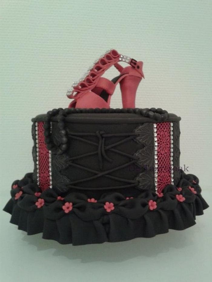 Corset style cake with high heeled shoe